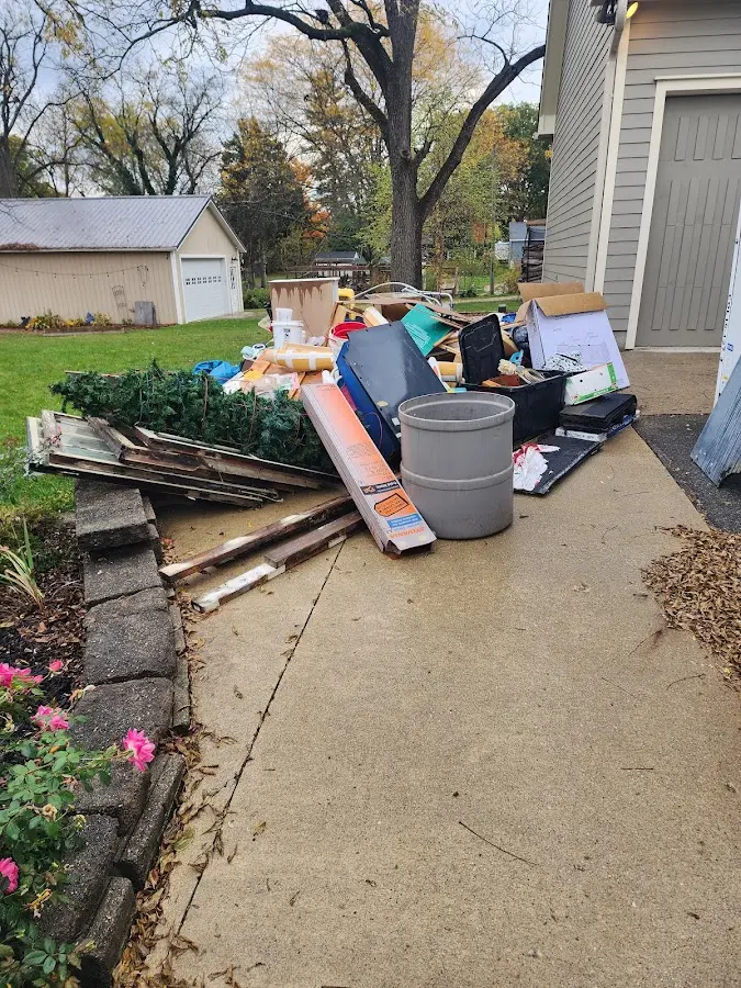 Dumpster being loaded with debris for 3 Yard Dumpster Rental in New Hartford